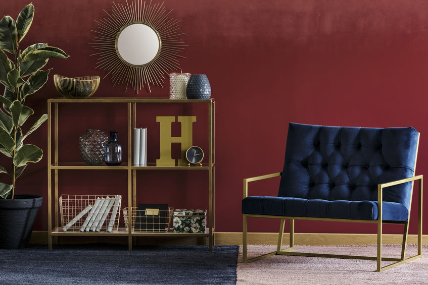 Interior view of Livingroom area, couch and burgundy accent wall